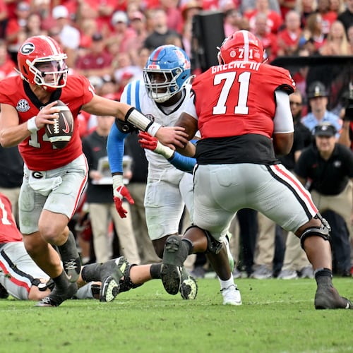Georgia quarterback Gunner Stockton had to help carry his team to a win over Ole Miss and that's what he did on Saturday, continuing to score points when the defense struggled to get stops. (Hyosub Shin/AJC)
