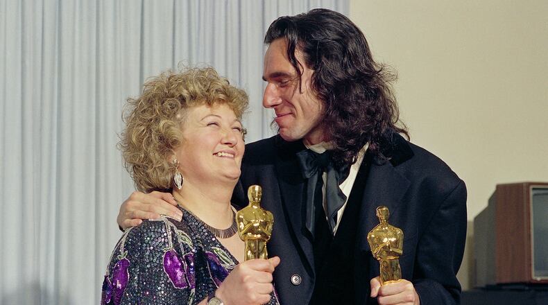 FILE - "My Left Foot" stars Brenda Fricker, winner of Oscar for best supporting actress, and Daniel Day Lewis, winner of Oscar for best actor, at the 62nd Annual Academy Awards in Los Angeles, March 26, 1990. (AP Photo/Bob Galbraith, File)