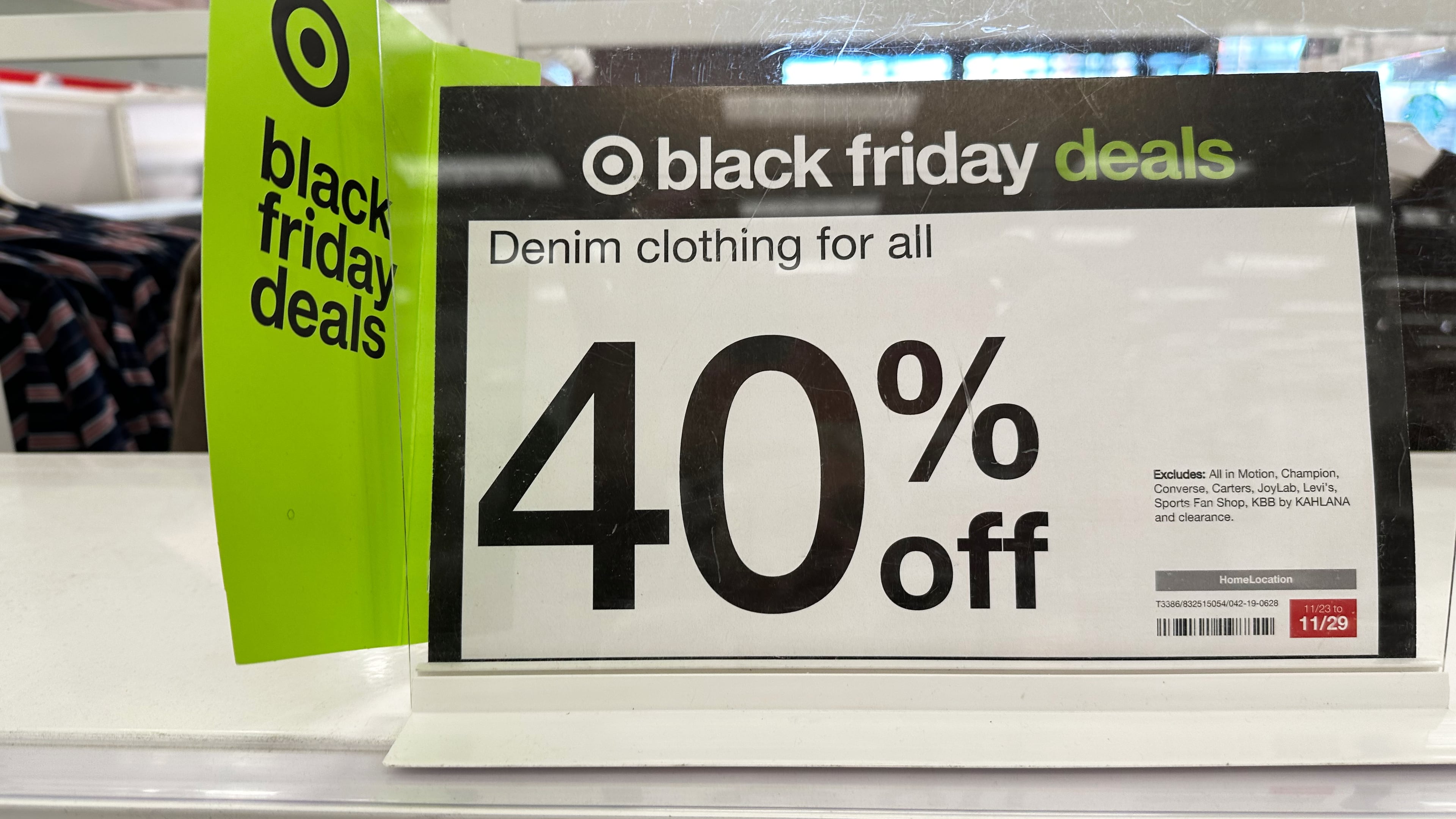 Signs denote Black Friday deals already available on clothing in a Target store, Wednesday, Nov. 26, 2025, in southeast Denver. (AP Photo/David Zalubowski)