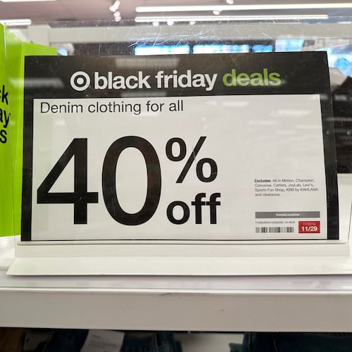 Signs denote Black Friday deals already available on clothing in a Target store, Wednesday, Nov. 26, 2025, in southeast Denver. (AP Photo/David Zalubowski)