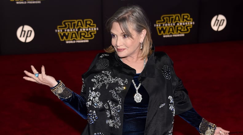 HOLLYWOOD, CA - DECEMBER 14: Actress Carrie Fisher attends the premiere of Walt Disney Pictures and Lucasfilm's 'Star Wars: The Force Awakens' at the Dolby Theatre on December 14, 2015 in Hollywood, California. (Photo by Ethan Miller/Getty Images)
