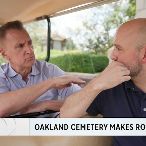 Brian Unger (left) during a CBS News Atlanta  piece he did on the Oakland Cemetery making plots available for sale for the first time in 145 years. He is speaking to Richard Harker, president of Historic Oakland Foundation. (CBS News Atlanta screenshot)