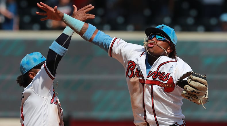 Braves teammates Ronald Acuna (right) and Ozzie Albies celebrate Atlanta's 15-1 victory over the Philadelphia Phillies Sunday, June 16, 2019, at SunTrust Park in Atlanta.