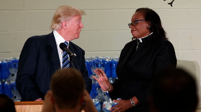 Rev. Faith Green Timmons interrupts Republican presidential candidate Donald Trump as he spoke during a visit to Bethel United Methodist Church, Wednesday, Sept. 14, 2016, in Flint, Mich. Timmons asked that Trump not deliver a political speech, and keep his message to the people of Flint. (AP Photo/Evan Vucci)