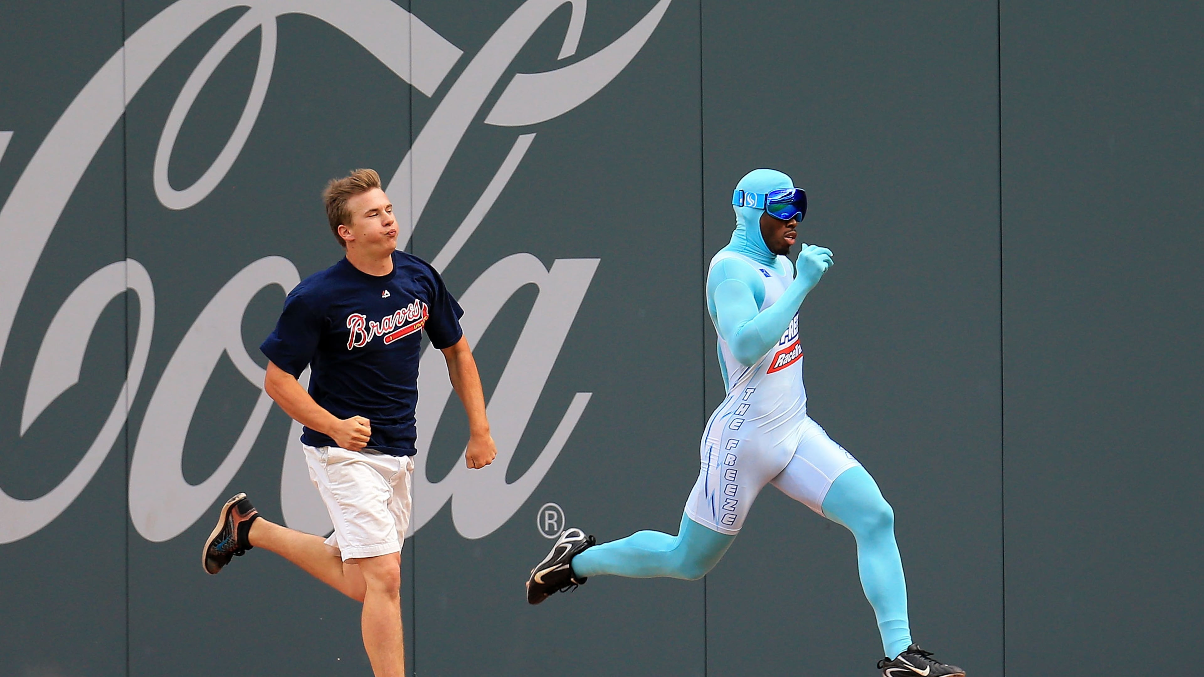 Nigel Talton, who was the original "Freeze," races a Braves fan between innings during a game in 2020. (AJC file)