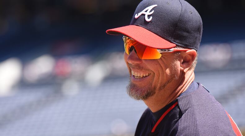 Braves legend Chipper Jones is all smiles before Monday's game. Hyosub Shin/hshin@ajc.com