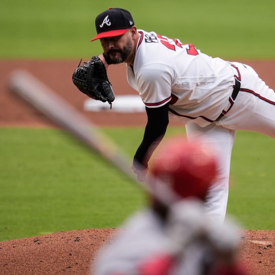 Atlanta Braves pitcher Martín Pérez (33) works against St. Louis Cardinals' Jordan Walker in the first inning of a baseball game, Tuesday, June 30, 2026, in Atlanta. (AP Photo/Mike Stewart)