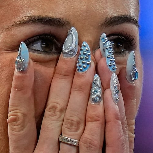 Amy Hunt of Britain celebrates winning the gold medal in the women's 200 meters final at the European Athletics Championships in Birmingham, England, Thursday, Aug. 13, 2026. (AP Photo/Petr David Josek)