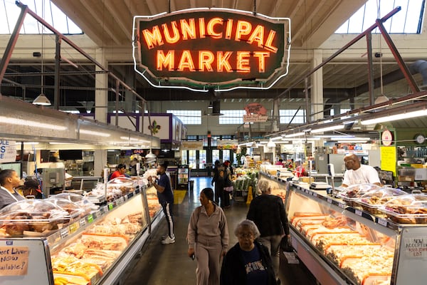 Customers browse the Municipal Market in Atlanta on Friday, October 18, 2024. (Arvin Temkar/AJC)