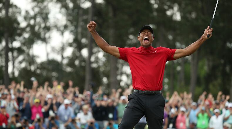 Tiger Woods celebrates after winning the Masters during the final round on Sunday, April 14, 2019, at Augusta National Golf Club in Augusta, Ga. (Jason Getz/Atlanta Journal-Constitution/TNS)