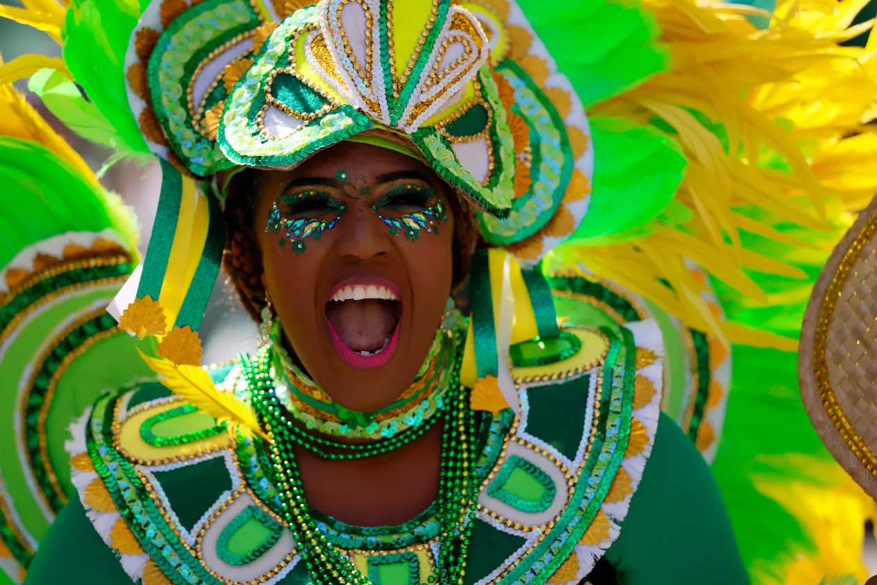 A member of Barabbas and the Tribe, a Bahamian junkanoo band, performs during Savannah’s St. Patrick’s Day celebration on Tuesday, March 17, 2026. The annual parade, which spans 3 miles through the historic district, attracts tens of thousands of spectators. (Miguel Martinez/AJC)