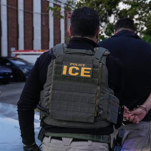FILE - U.S. Immigration and Customs Enforcement agents make an arrest during an early morning operation in Park Ridge, Ill., Sept. 19, 2025. (AP Photo/Erin Hooley, File)