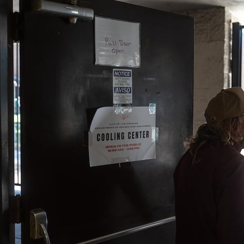Daniel Aragonez leaves a cooling center in Los Angeles, Friday, July 31, 2026. (AP Photo/Jae C. Hong)