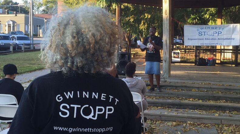 Gwinnett Parent Coalition to Dismantle the School to Prison Pipeline founder Marlyn Tillman listens as a speaker addressed the audience at a rally it held to address school disciplinary policies in Gwinnett County and statewide. AJC FILE PHOTO.