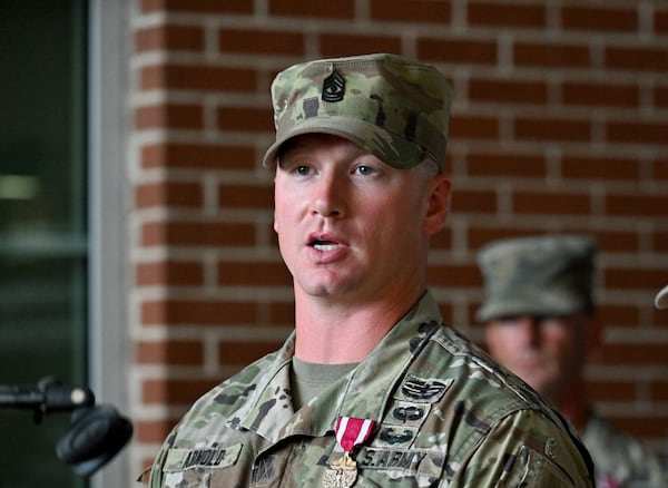 1st Sgt. Joshua Arnold, one of the six soldiers who received the Meritorious Service Medal Thursday, said he began yelling to alert others after hearing gunshots at Fort Stewart. He joined a fellow soldier in rendering aid to wounded troops. “It was training that kicked in,” Arnold said. “You just go to work.” (Hyosub Shin / AJC)