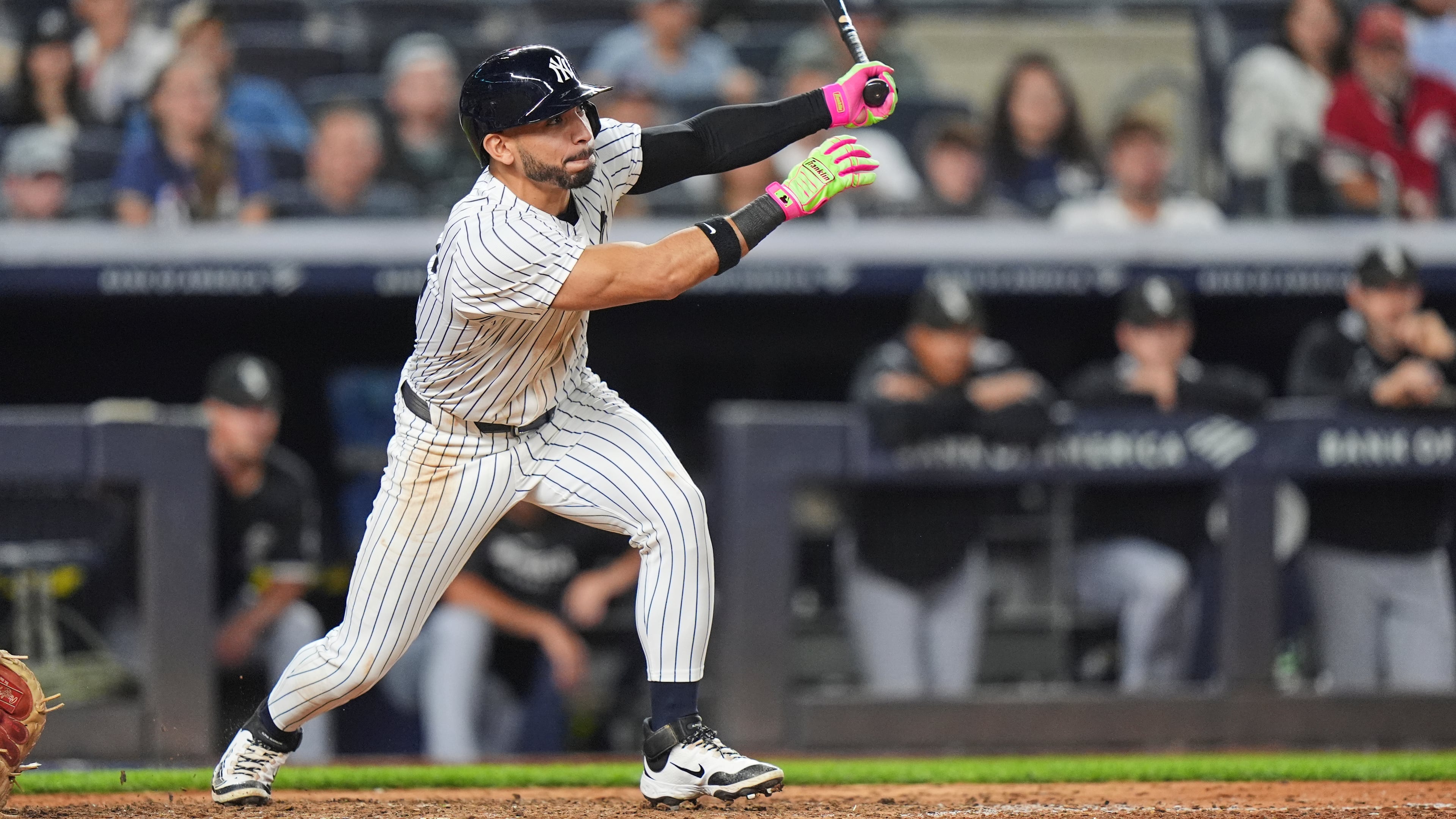 New York Yankees' José Caballero follows through on a walk-off RBI single during the ninth inning of a baseball game against the Chicago White Sox Tuesday, Sept. 23, 2025, in New York. (AP Photo/Frank Franklin II)