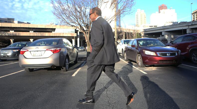 Atlanta contractor Elvin “E.R.” Mitchell Jr. returns to his car after a January hearing where he pleaded guity in the Atlanta City Hall bribery investigation. (HENRY TAYLOR / HENRY.TAYLOR@AJC.COM)