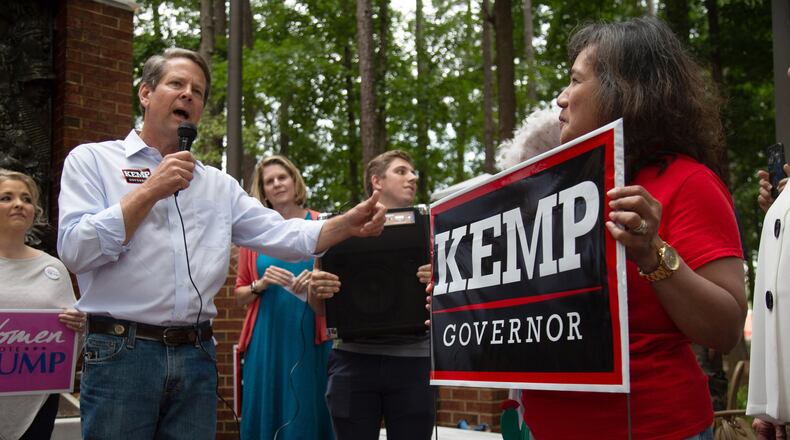 Secretary of State Brian Kemp talks to a small crowd at a rally at the Roswell City Hall Sunday, July 22, 2018. STEVE SCHAEFER / SPECIAL TO THE AJC