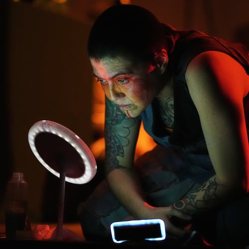 Mexican composer Maria Leonora performs her series she calls “Through All the Fire,” at the Sergio Magaña Theater in Mexico City, Friday, Nov. 28, 2025. (AP Photo/Claudia Rosel)