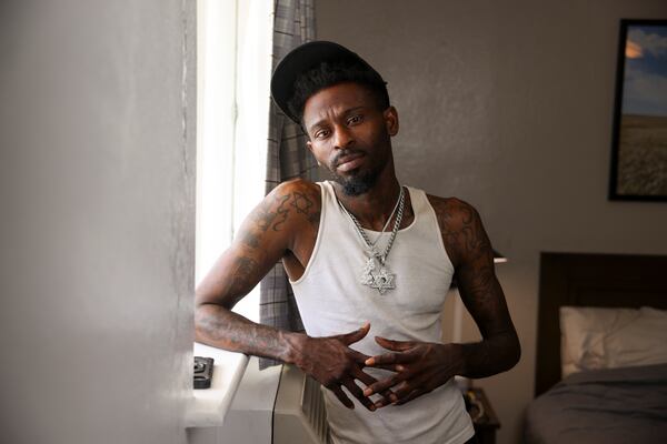Former Waffle House employee Edric Riley, known as Rockstar Riley. He is now driving for DoorDash and living in a hotel room and trying to make something of his music. (Jason Getz/AJC)