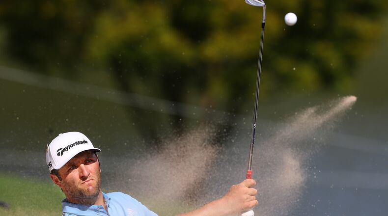 Jon Rahm hits from the bunker to the 9th green during his third round of the Tour Championship Sunday, Sept. 6, 2020, at East Lake Golf Club in Atlanta. (Curtis Compton / Curtis.Compton@ajc.com)