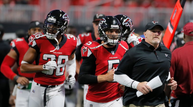 8/26/17 - Atlanta, GA - Coach Dan Quinn leads his team off the field at the half. The first game in Mercedes-Benz Stadium was Saturday, as the Atlanta Falcons played Arizona in an exhibition game.. BOB ANDRES /BANDRES@AJC.COM