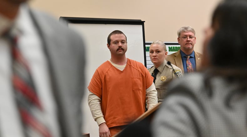 Michael Helterbrand is escorted out after Judge Jack Niedrach denied a bond at Floyd County Superior Court in Rome in February 2020. A judge denied bond to two men accused of belonging to a white supremacist group that allegedly plotted to kill a Bartow County couple, overthrow the government and start a race war. (Hyosub Shin / Hyosub.Shin@ajc.com)