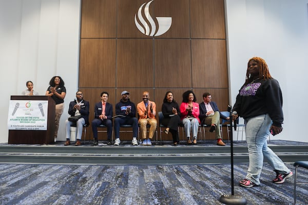 (L-R) APS students Laila Shannon and Anissah Baker moderate a town hall with school board candidates Jonathan Leon, Royce Mann, Tony Mitchell, Tolton Pace, Aisha Stith, Kaycee Brock and Stephen Owens at Georgia State University's Dahlberg Hall in Atlanta on Wednesday, Oct. 8, 2025. (Abbey Cutrer/AJC)