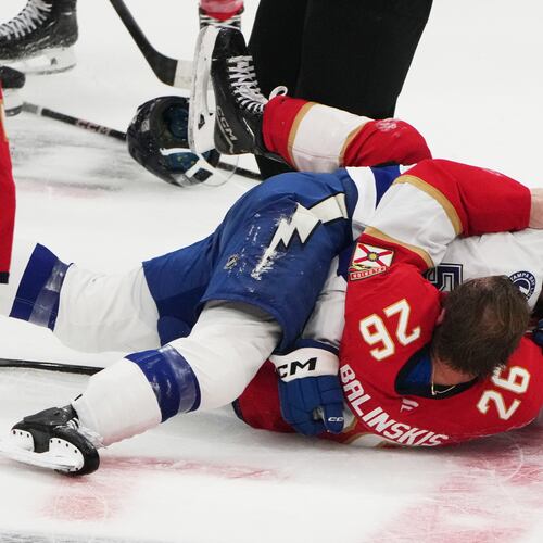 FILE - Florida Panthers defenseman Uvis Balinskis (26) and Tampa Bay Lightning Dylan Duke, right, scuffle during the third period of a preseason NHL hockey game, Saturday, Oct. 4, 2025, in Sunrise, Fla. (AP Photo/Lynne Sladky, File)