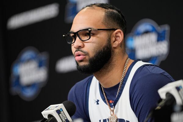 Auburn forward Johni Broome speak during a news conference, Thursday, March 27, 2025, in Atlanta, ahead of the Sweet 16 in the NCAA college basketball tournament. (AP Photo/George Walker IV)