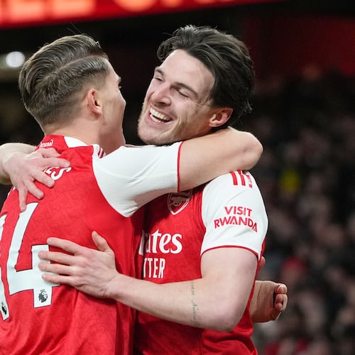 Arsenal's Viktor Gyoekeres and Arsenal's Declan Rice celebrate after Brighton's Georginio Rutter scored an own goal during the English Premier League soccer match between Arsenal and Brighton and Hove Albion in London, Saturday, Dec. 27, 2025. (AP Photo/Kirsty Wigglesworth)
