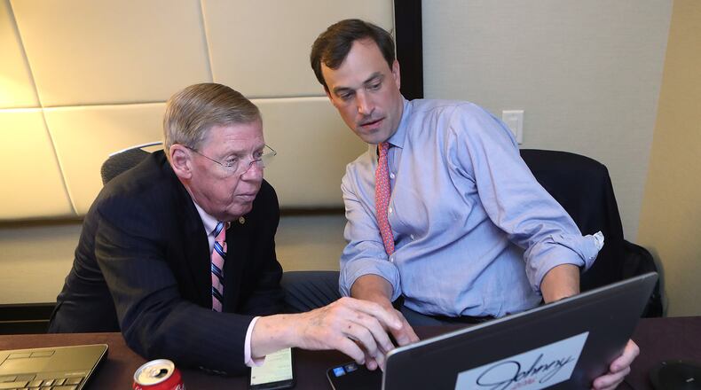 U.S. Senator Johnny Isakson and campaign manager Trey Kilpatrick watch returns from his war room upstairs from the Republican watch party at the Grand Hyatt, Buckhead on Election Day in 2016. Curtis Compton /ccompton@ajc.com