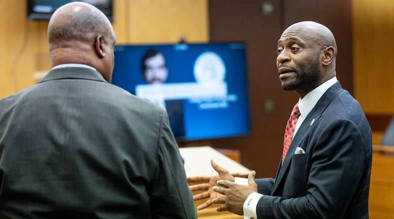Rudy Giuliani's lawyer Bill Thomas (L) and Futlon prosecutor Nathan Wade talk after a hearing in Fulton County Superior Court on Thursday, August 9, 2022. Steve Schaefer / steve.schaefer@ajc.com)