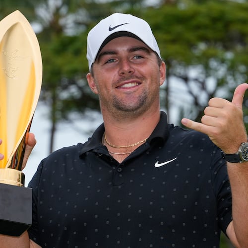 Chris Gotterup holds his trophy after winning the Sony Open golf event at the Waialae Country Club in Honolulu, Sunday, Jan. 18, 2026. (AP Photo/Matt York)