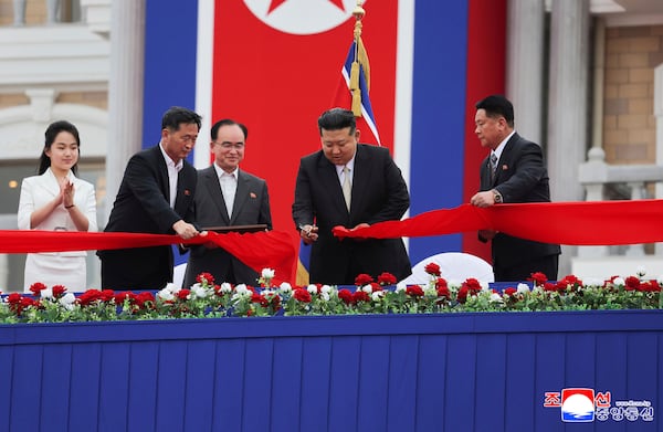 In this photo provided by the North Korean government, North Korean leader Kim Jong Un, second right, with his daughter, left, cuts the inaugural tape during a completion ceremony of the Wonsan-Kalma coastal tourist zone in North Korea Tuesday, June 24, 2025. Independent journalists were not given access to cover the event depicted in this image distributed by the North Korean government. The content of this image is as provided and cannot be independently verified. Korean language watermark on image as provided by source reads: "KCNA" which is the abbreviation for Korean Central News Agency. (Korean Central News Agency/Korea News Service via AP)