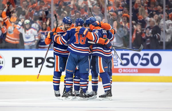 Edmonton Oilers players celebrate a goal against the Los Angeles Kings during the third period of an NHL playoff game in Edmonton on Sunday, April 27, 2025. (Jason Franson/The Canadian Press via AP)