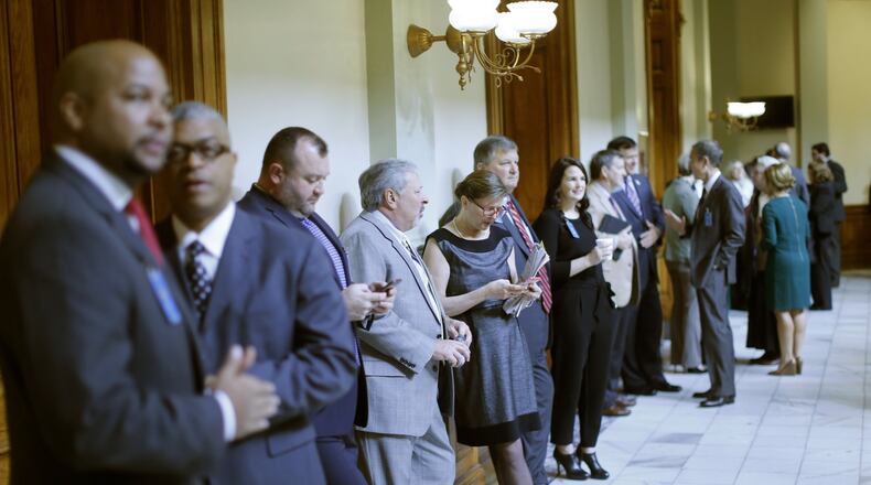 Registered lobbyists line the halls during the 2016 legislative session. Lobbyists in Georgia are required to register with the state ethics commission but some think many avoid doing so. BOB ANDRES / BANDRES@AJC.COM