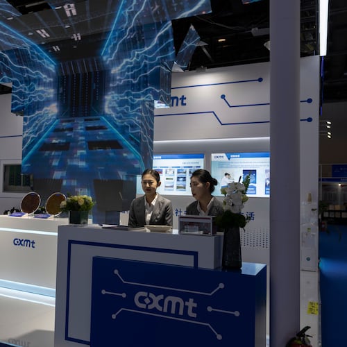 FILE - Workers at the booth for Chinese DRAM producer ChangXin Memory Technologies, also known as CXMT, wait for visitors at the 21st China International Semiconductor Expo in Beijing, Nov. 20, 2024. (AP Photo/Ng Han Guan, File)