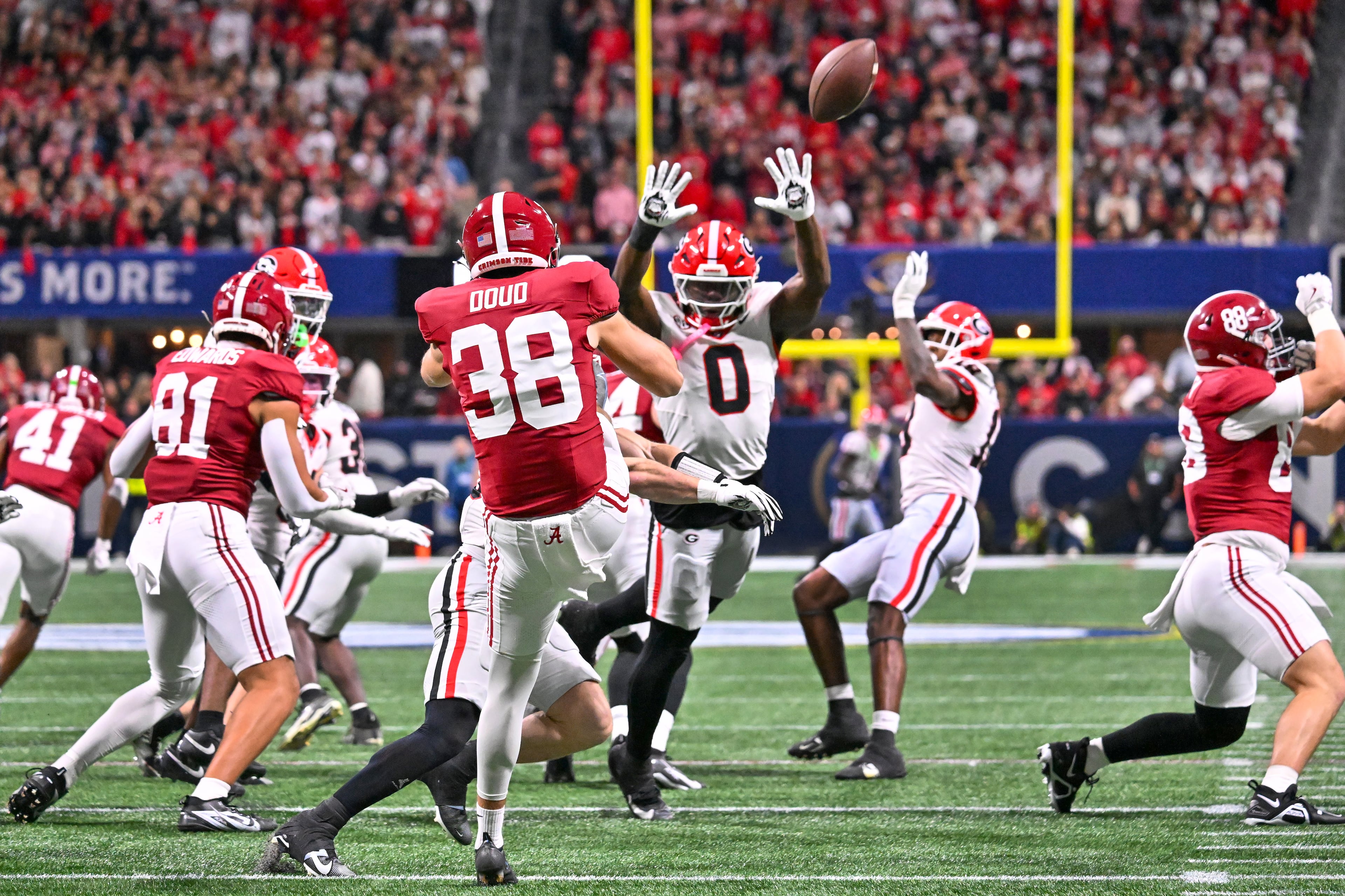 Georgia linebacker Gabe Harris Jr. (0) helps block the punt by Alabama punter Blake Doud (38) during the first quarter of the SEC Championship game at Mercedes-Benz Stadium, Saturday, Dec. 6, 2025, in Atlanta. (Hyosub Shin / AJC)
