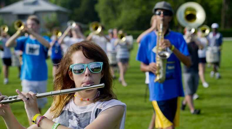 Marching band is a demanding high school activity, often including a week or more of eight-hour practice days in mid-July.