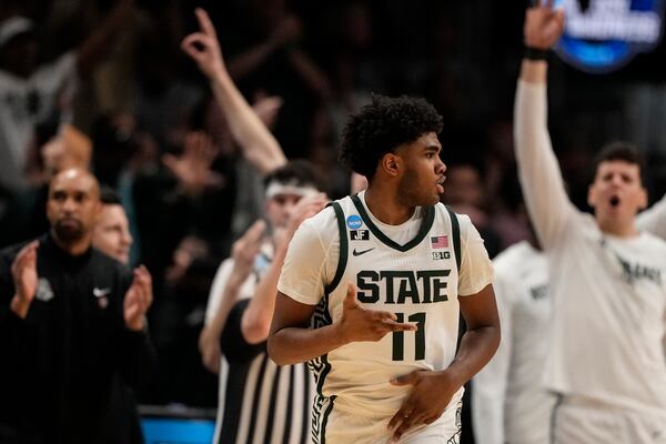Michigan State guard Jase Richardson (11) reacts to a basket against Mississippi during the second half in the Sweet 16 of the NCAA college basketball tournament, Friday, March 28, 2025, in Atlanta. (AP Photo/Brynn Anderson)