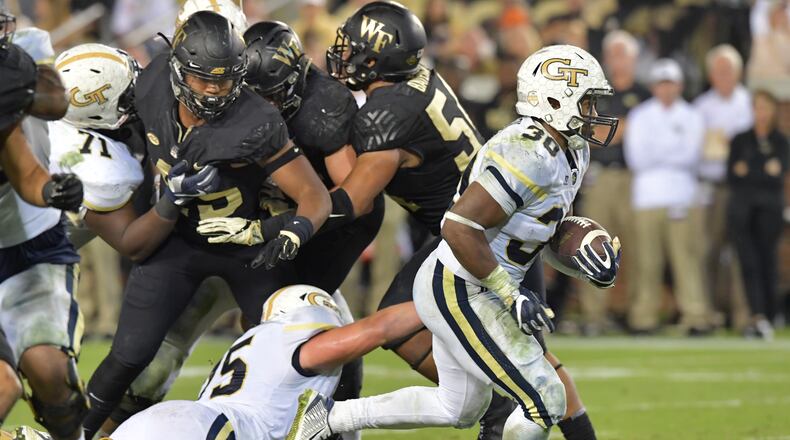 October 21, 2017 Atlanta - Georgia Tech running back KirVonte Benson (30) breaks away for a go-ahead touchdown in the second half of an NCAA college football game at Bobby Dodd Stadium on Saturday, October 21, 2017. Georgia Tech beat Wake Forest 38-24. HYOSUB SHIN / HSHIN@AJC.COM