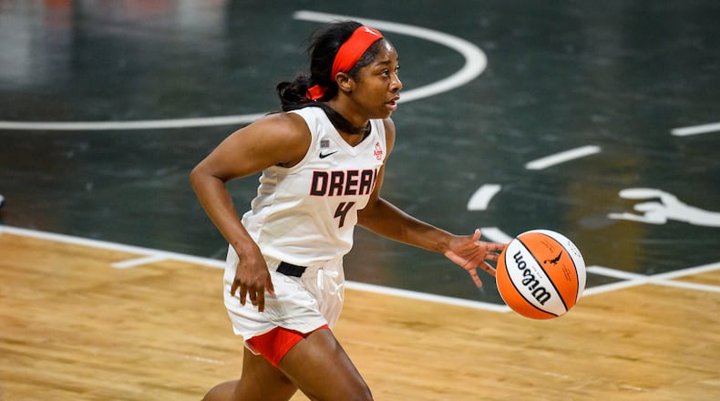 Dream guard Aari McDonald (4) moves the ball during a game against the Chicago Sky, Wednesday, May 19, 2021. (AP Photo/Danny Karnik)