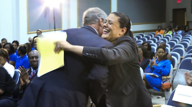 Georgia Tech President G.P. “Bud” Peterson (left) hugs Atlanta Public Schools Superintendent Meria Carstarphen (right) in August 2014, when an initiative was announced to grant admission to APS valedictorians and salutatorians. JOHN SPINK/JSPINK@AJC.COM