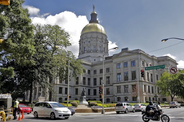 Georgia State Capitol, the Gold Dome, in downtown Atlanta in August 2023. Republican state lawmakers say if local governments try to protect immigrants with "sanctuary" policies, the state should strip them of their immunity to being sued. (Bob Andres/The Atlanta Journal-Constitution/TNS)