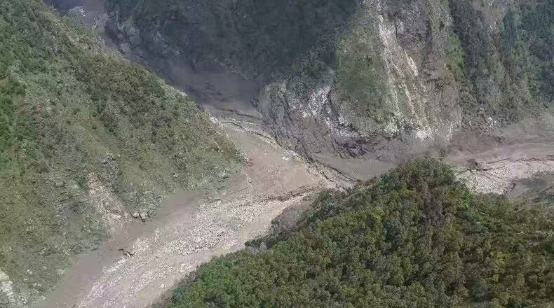 This photo released by Xinhua News Agency, shows a mudslide-hit area near Gyirong Port in southwestern China's Tibetan Autonomous Region on Wednesday, Aug. 26, 2026. (Xinhua via AP)