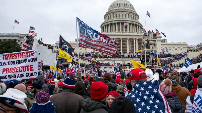 FILE - Rioters loyal to President Donald Trump rally at the U.S. Capitol in Washington, Jan. 6, 2021. (AP Photo/Jose Luis Magana, File)