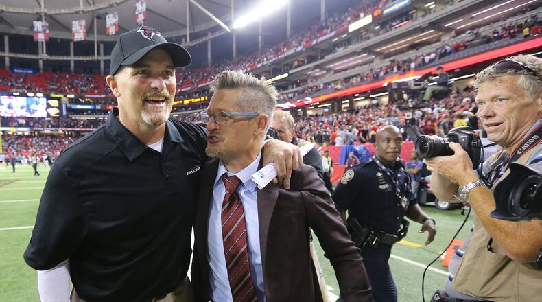 Dan Quinn and Thomas Dimitroff were all smiles after winning the season opener here and starting the season 5-0, but the Falcons slid from there and missed the playoffs. (Curtis Compton / ccompton@ajc.com)