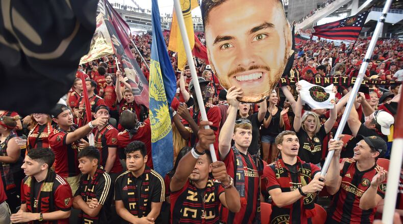 September 16, 2017 Atlanta - Atlanta United fans cheer before an MLS soccer match at Mercedes-Benz Stadium on Saturday, September 16, 2017. Saturdayâs Atlanta United match against Orlando City will be the third at Mercedes-Benz for the first-year franchise, and a new Major League Soccer single-game attendance record is expected to be set in the latest meeting of the southern MLS rivals. HYOSUB SHIN / HSHIN@AJC.COM