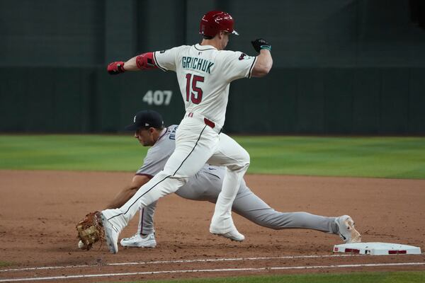 Braves first baseman Matt Olson snags the final out of Atlanta's win over Arizona on Saturday.